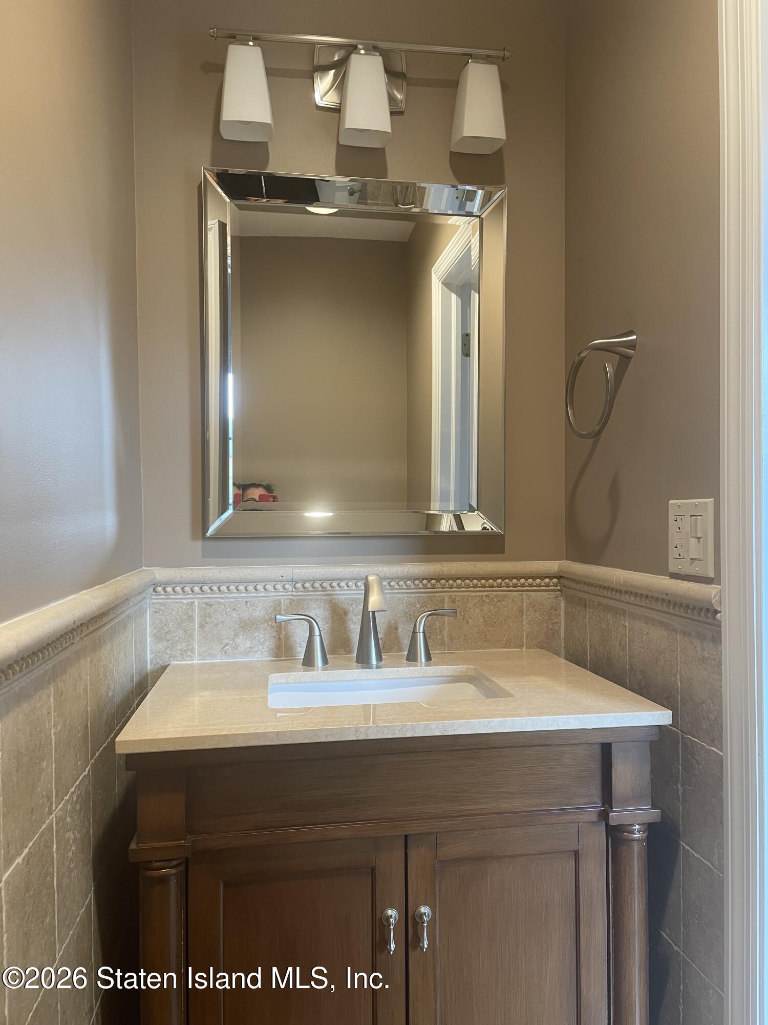 951 West Fingerboard Road Staten Island, NY 10304 - Photo 23 of 29 a bathroom with a sink and a mirror