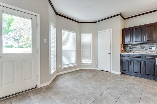 a view of a kitchen with a sink and a window