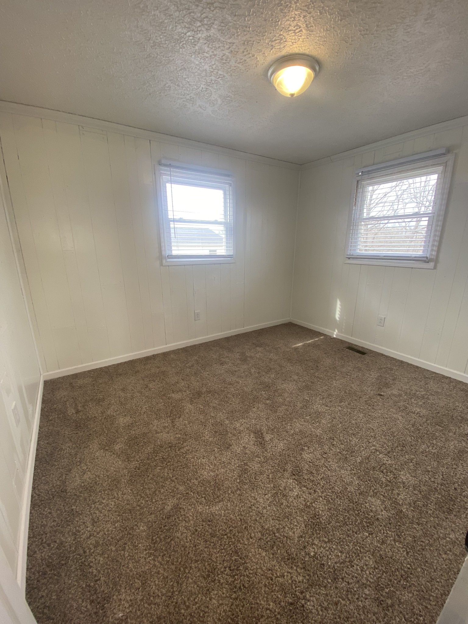 825 Moore Hollow Road Tennessee Ridge, TN 37178 - Photo 11 of 12 an empty room with a empty space and windows