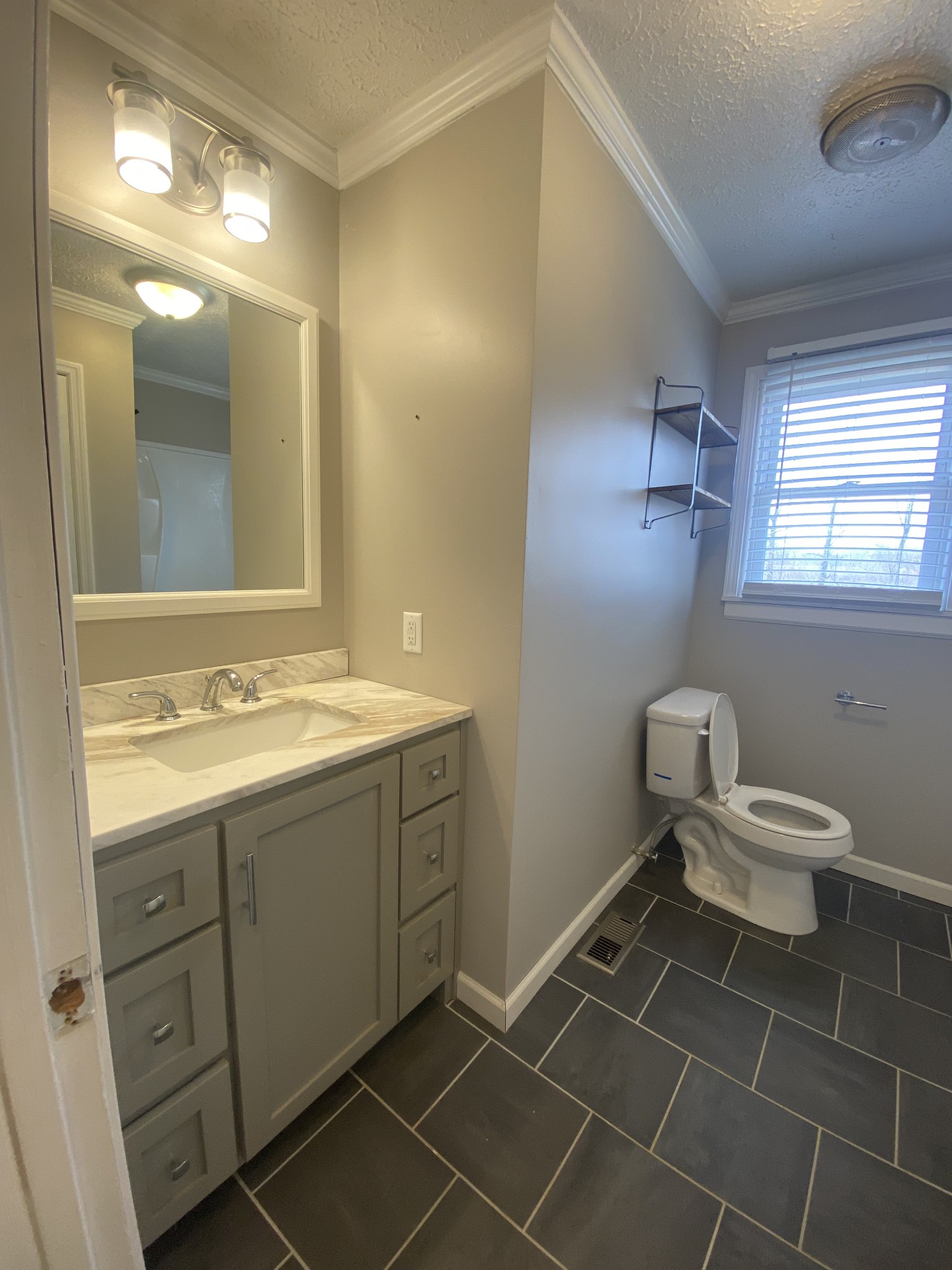 825 Moore Hollow Road Tennessee Ridge, TN 37178 - Photo 8 of 12 a bathroom with a toilet sink and mirror