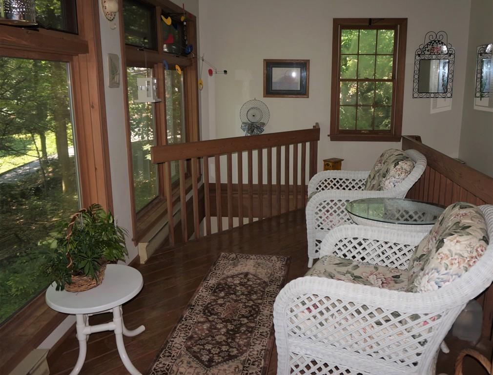 522 Leadmine Road Sturbridge, MA 01566 - Photo 13 of 33 a balcony with furniture and a potted plant