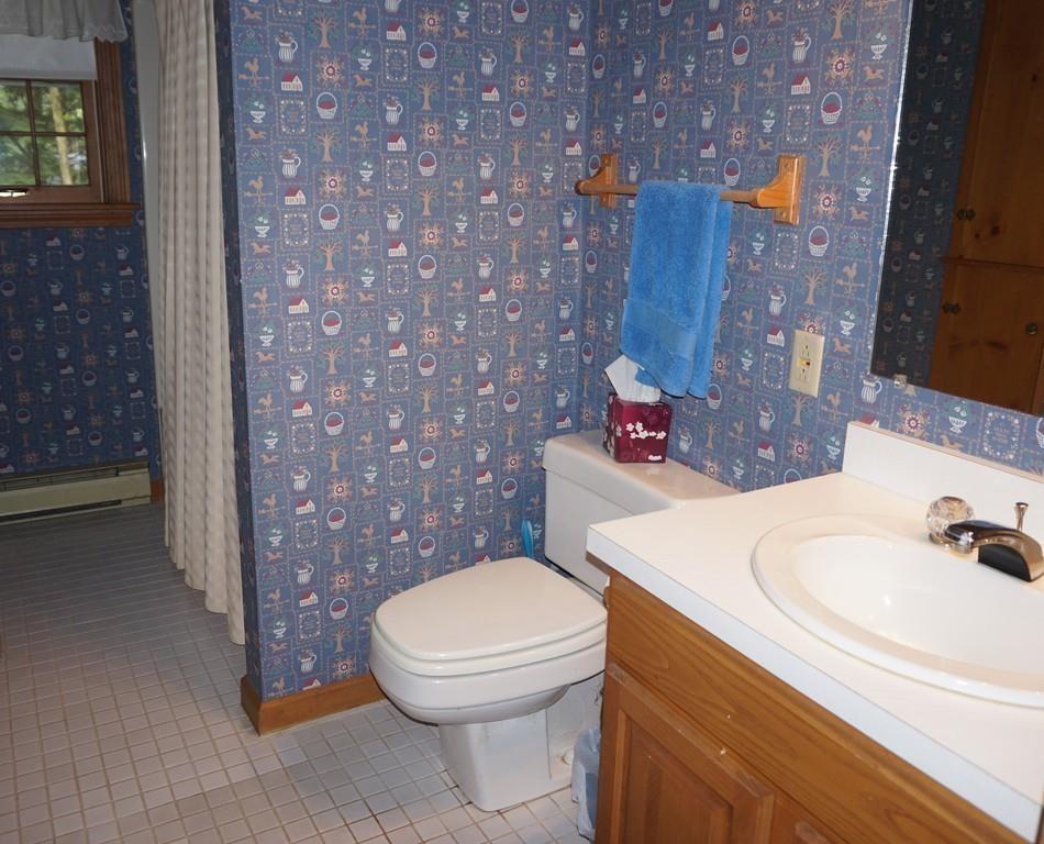 522 Leadmine Road Sturbridge, MA 01566 - Photo 18 of 33 a bathroom with a sink a toilet and mirror