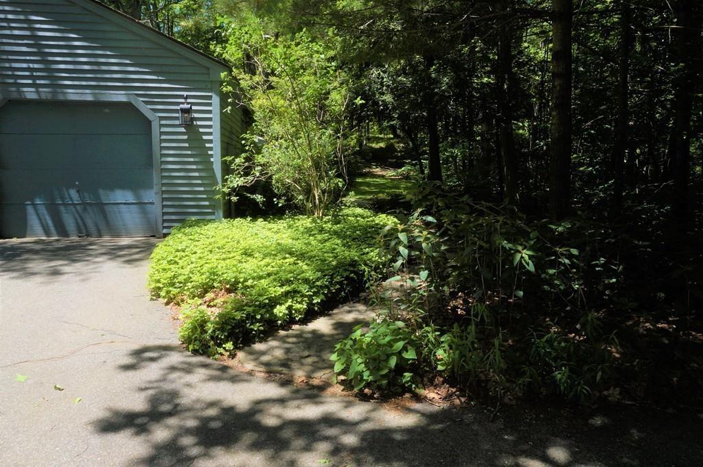 522 Leadmine Road Sturbridge, MA 01566 - Photo 30 of 33 a backyard of a house with lots of green space and fountain