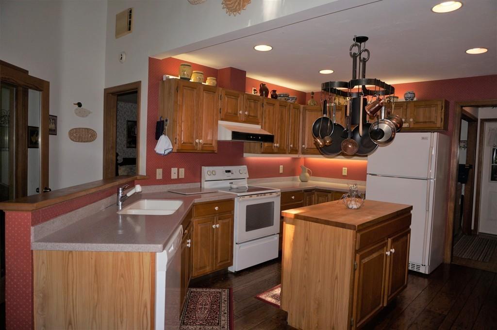 522 Leadmine Road Sturbridge, MA 01566 - Photo 5 of 33 a kitchen with stainless steel appliances granite countertop a sink a stove and a refrigerator