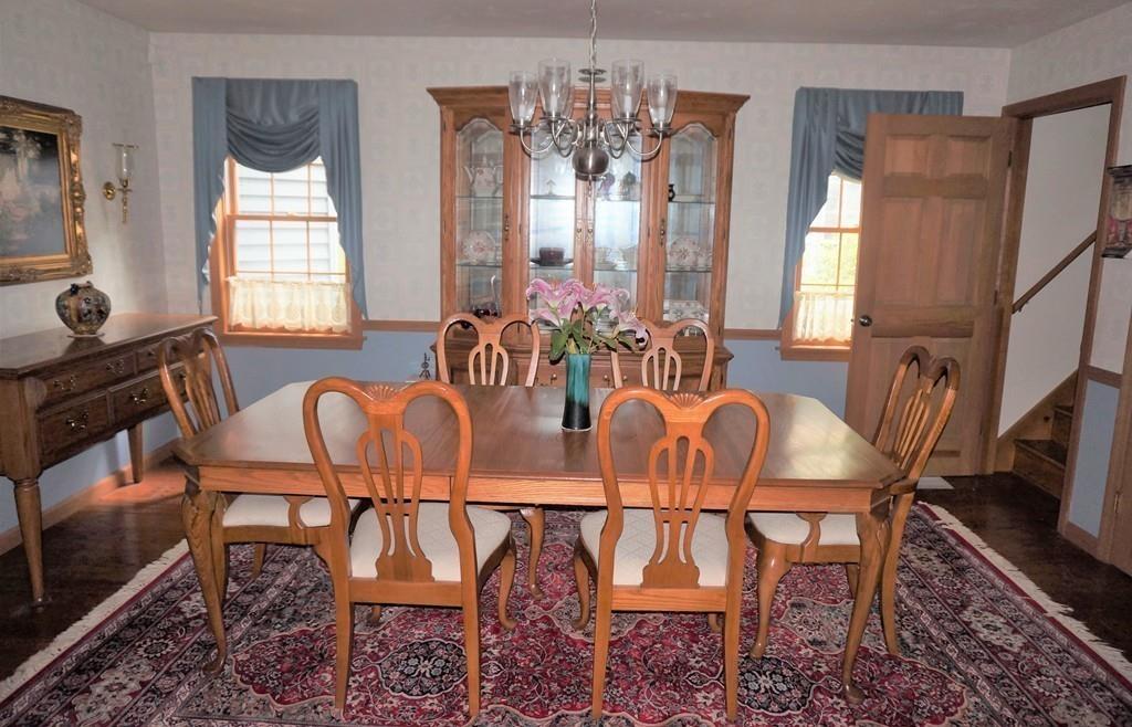 522 Leadmine Road Sturbridge, MA 01566 - Photo 8 of 33 a dining room with furniture a chandelier and window