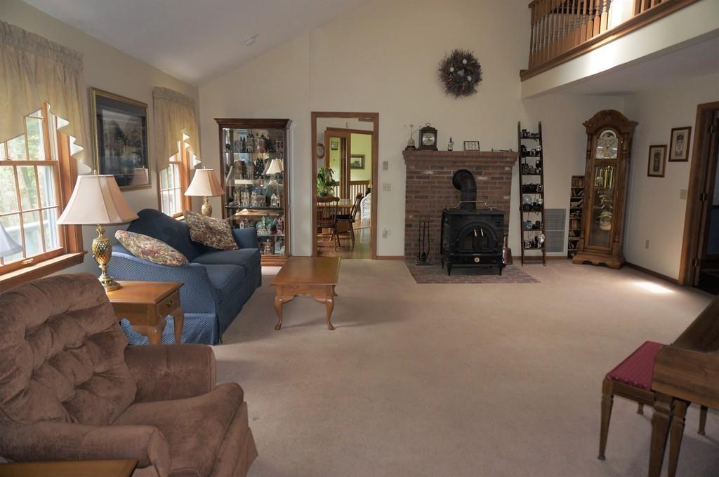 522 Leadmine Road Sturbridge, MA 01566 - Photo 10 of 33 a living room with furniture and a fireplace