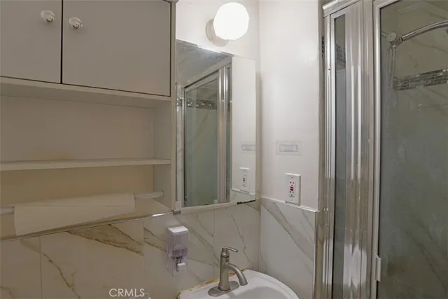 a bathroom with a tub and shower