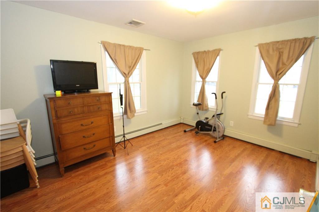 30 Brookville Road Edison, NJ 08817 - Photo 12 of 25 a view of room with wooden floor and furniture