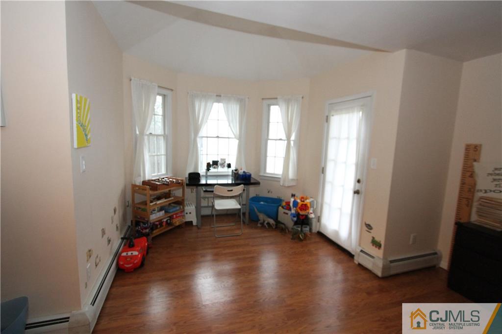 30 Brookville Road Edison, NJ 08817 - Photo 16 of 25 a living room with furniture and wooden floor