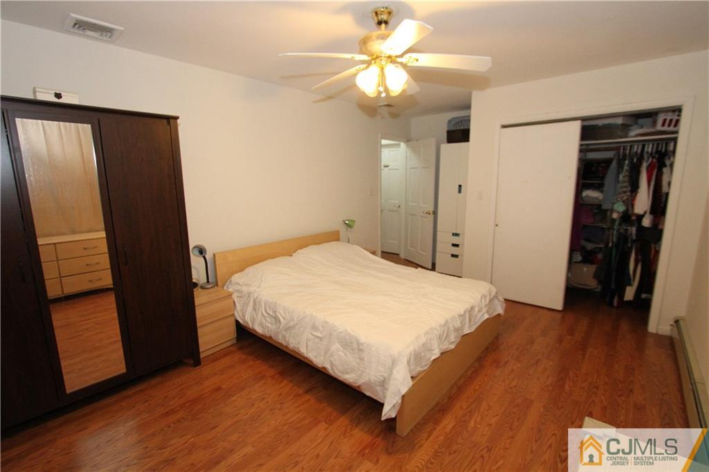 30 Brookville Road Edison, NJ 08817 - Photo 20 of 25 a bedroom with a bed and a walk in closet