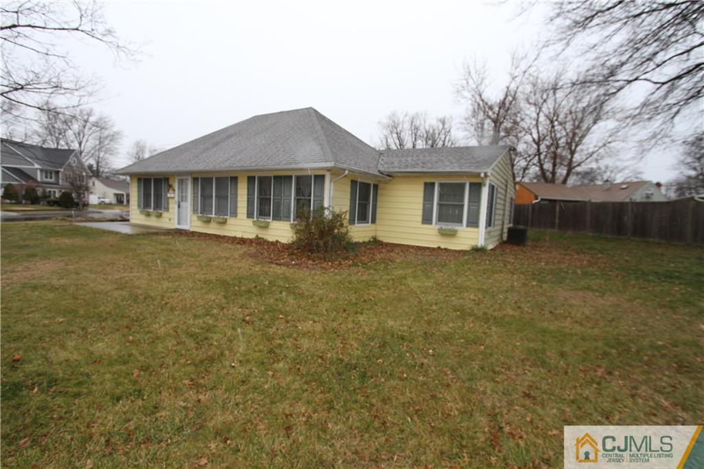 30 Brookville Road Edison, NJ 08817 - Photo 4 of 25 a front view of a house with a yard