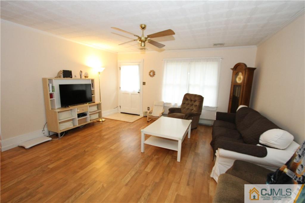 30 Brookville Road Edison, NJ 08817 - Photo 6 of 25 a living room with furniture and a flat screen tv