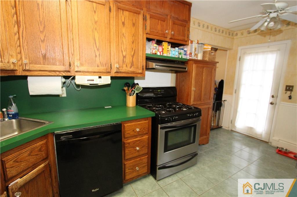 30 Brookville Road Edison, NJ 08817 - Photo 9 of 25 a kitchen with stainless steel appliances granite countertop a stove and a refrigerator