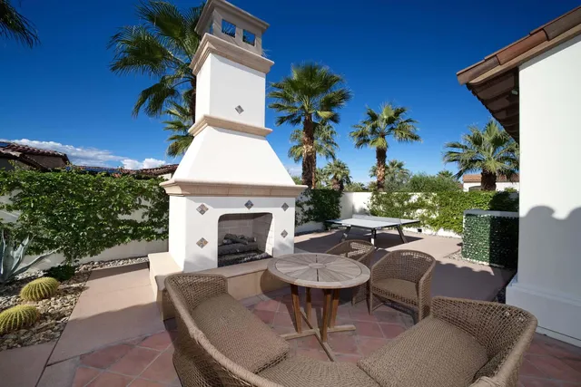 a view of a dining room with furniture wooden floor and a rug