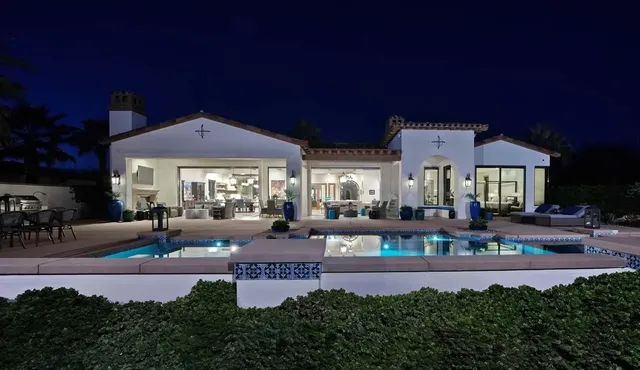 a spacious bathroom with a double vanity sink a mirror a bathtub and a shower