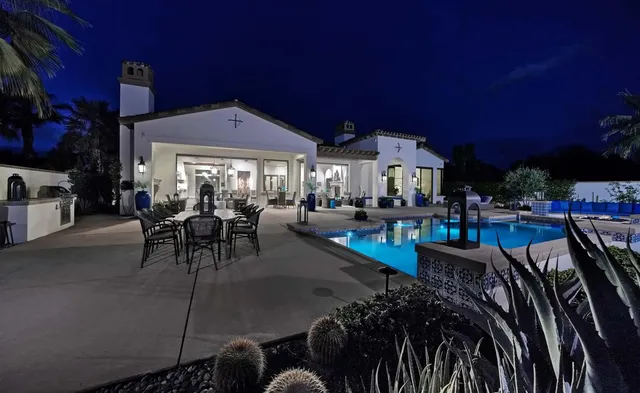 a work room with furniture and a chandelier