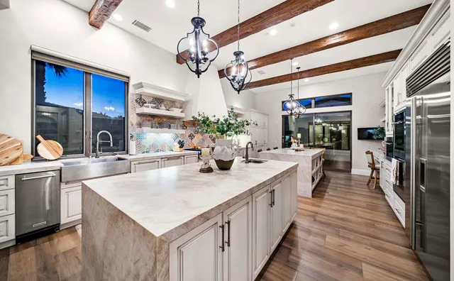 a view of a house with a yard and sitting area