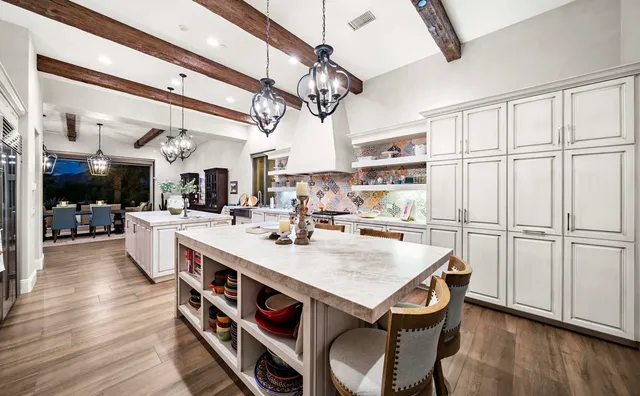 a view of a chairs and table on the garden