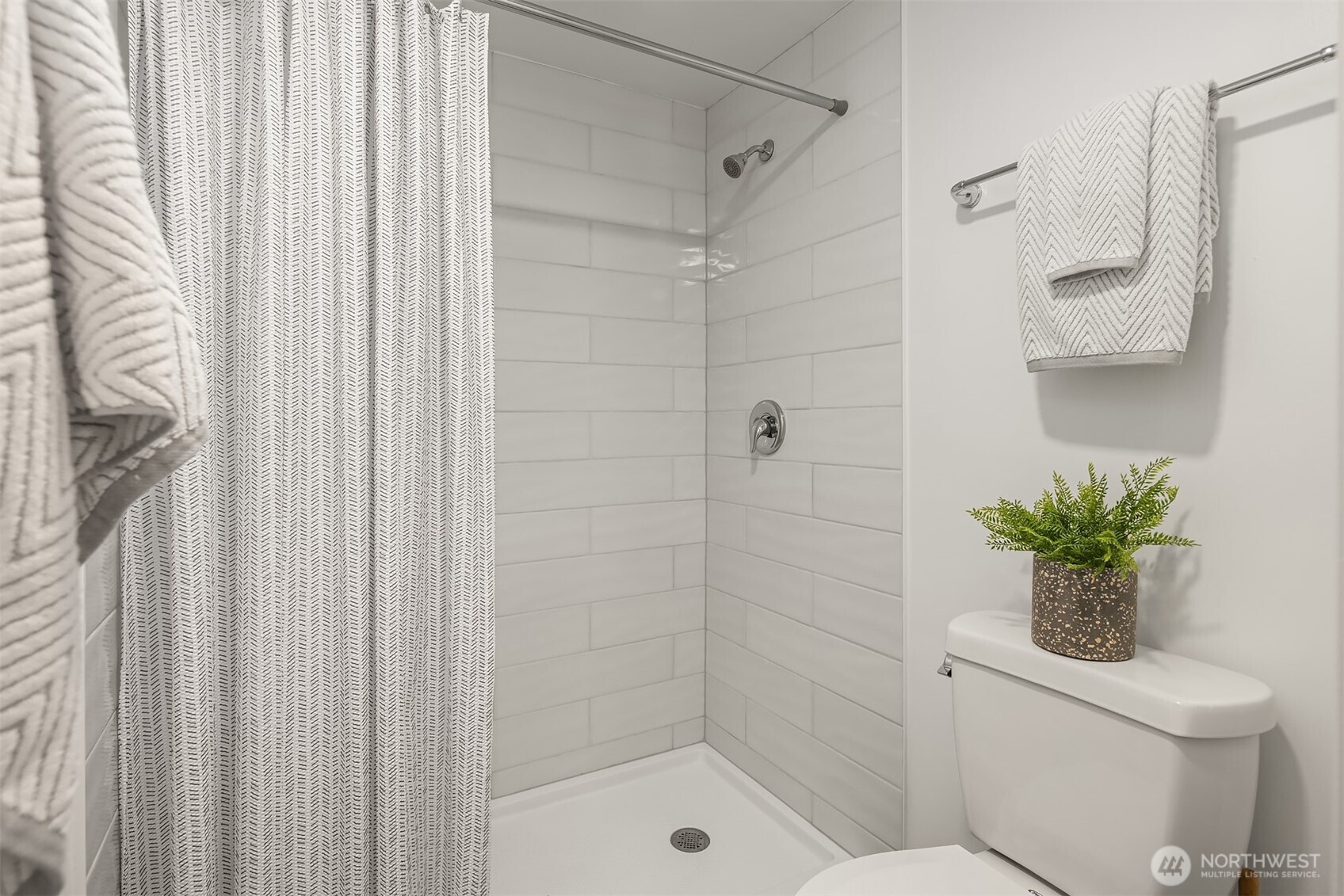 1507 Western Avenue, Unit R501 Seattle, WA 98101 - Photo 21 of 35 a bathroom with a shower a toilet and a sink