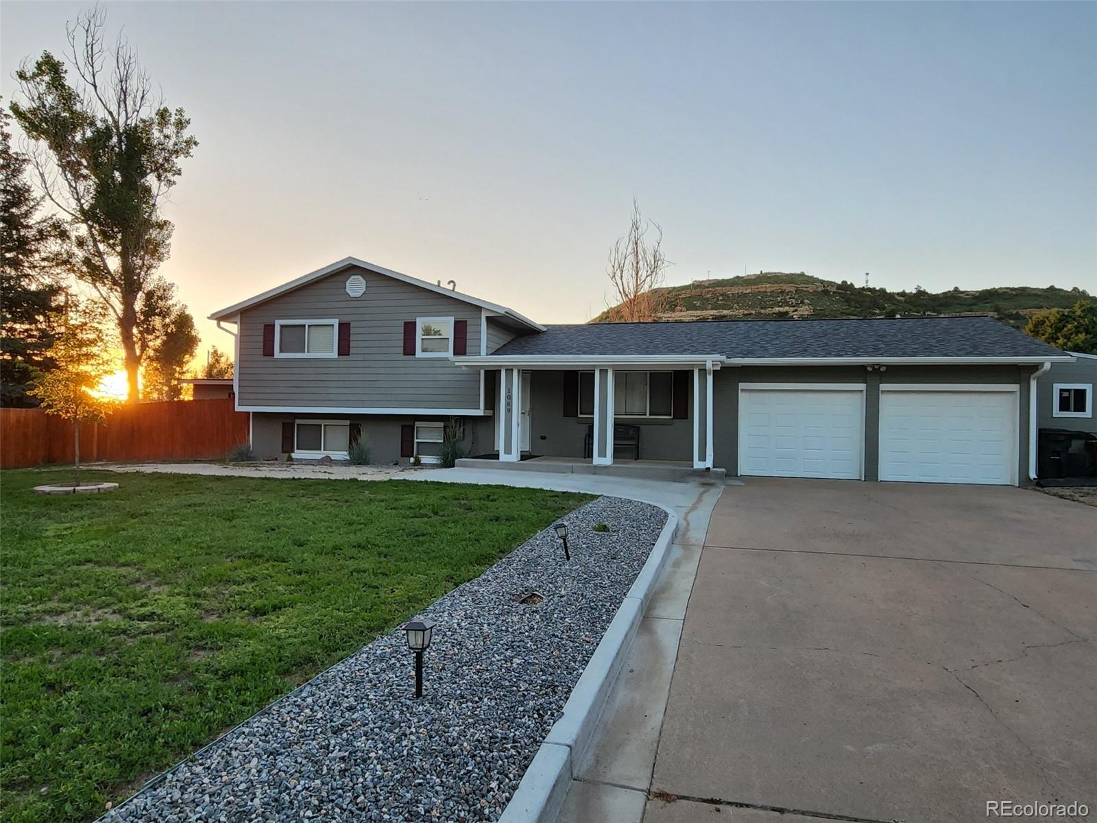 1069 Bulkey Street Castle Rock, CO 80108 - Photo 2 of 4 front view of a house with a yard