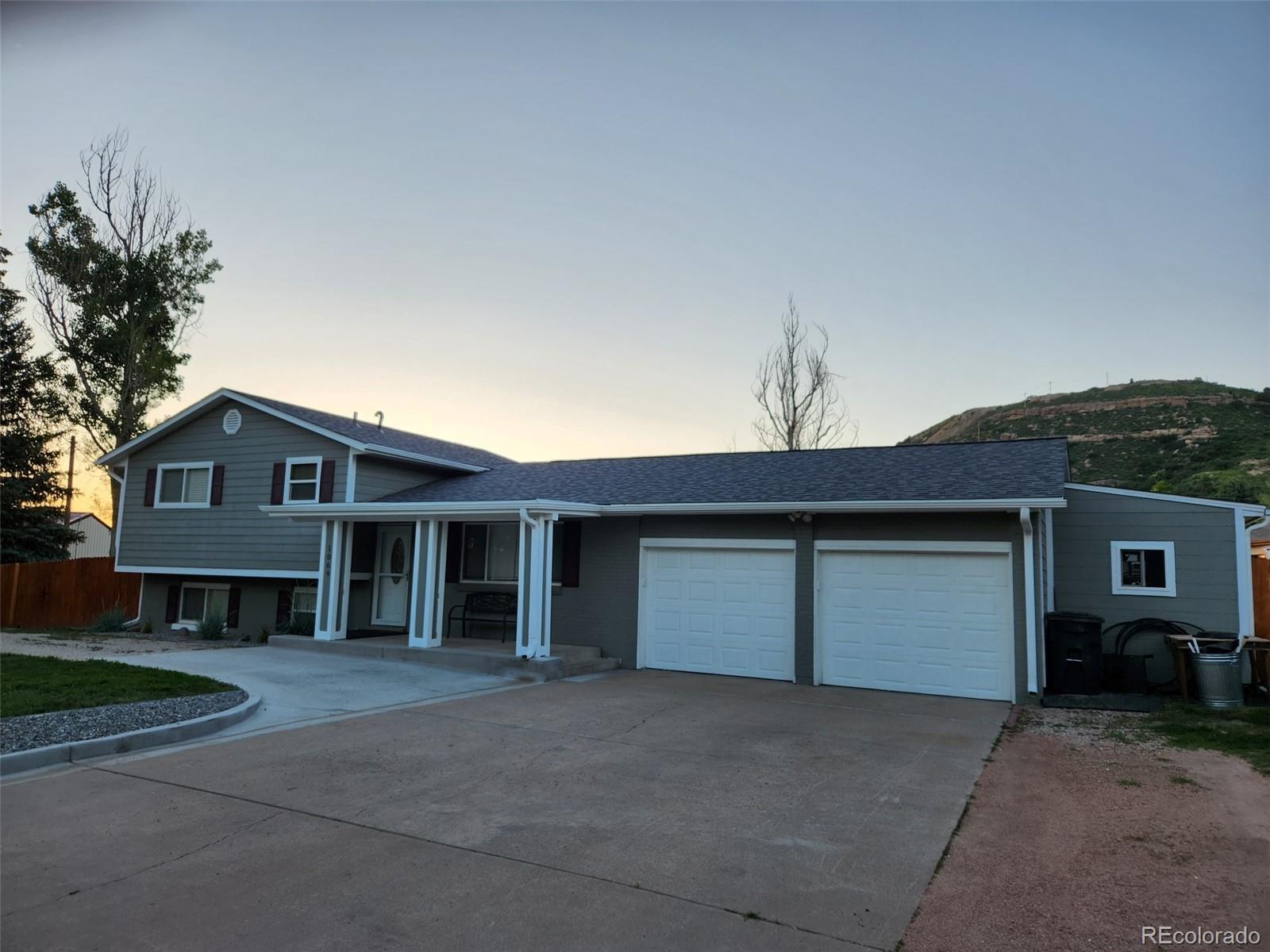 1069 Bulkey Street Castle Rock, CO 80108 - Photo 4 of 4 front view of a house with a yard and a garage