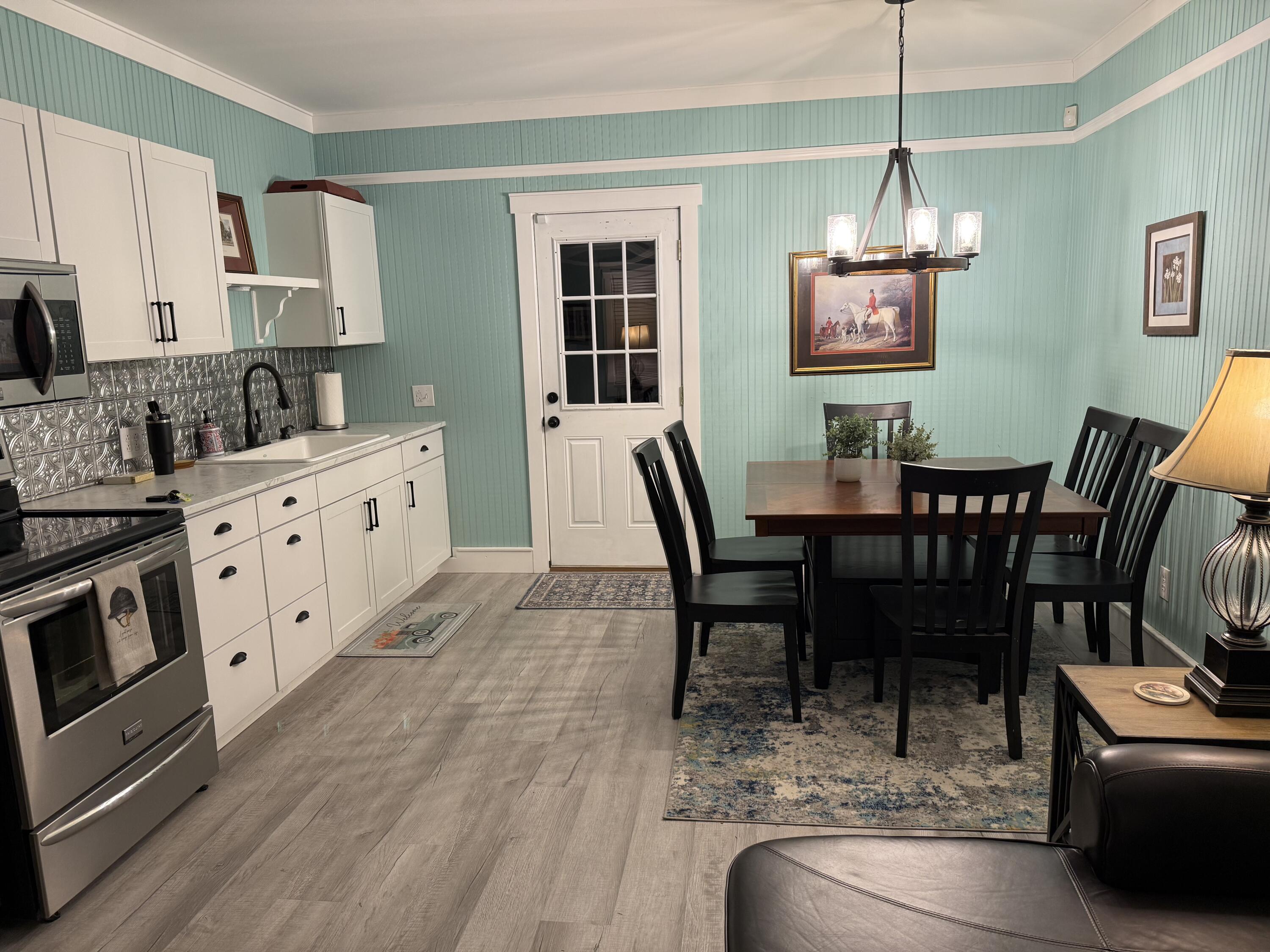 357 North Windsor Road Windsor, SC 29856 - Photo 6 of 20 a view of a dining room with furniture a chandelier and wooden floor