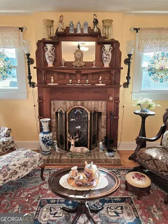 a dining room with furniture and wooden floor