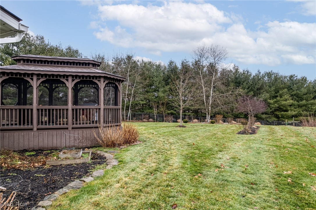 1838 Sandy Lake Road Ravenna, OH 44266 - Photo 3 of 41 Gorgeous, landscaped lot with screened gazebo and rear deck.