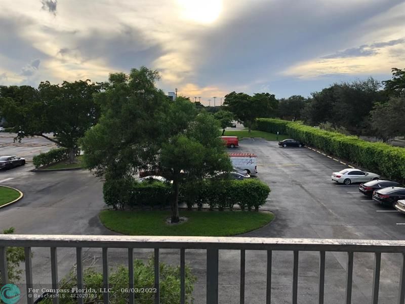 8540 Sherman Circle North, Unit 302 Miramar, FL 33025 - Photo 16 of 18 a view of a street with a yard