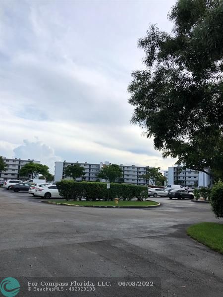8540 Sherman Circle North, Unit 302 Miramar, FL 33025 - Photo 18 of 18 a view of street with parked cars