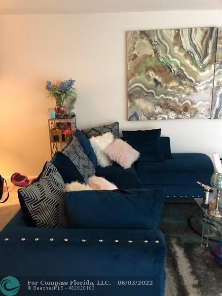 8540 Sherman Circle North, Unit 302 Miramar, FL 33025 - Photo 9 of 18 a living room with furniture and a rug