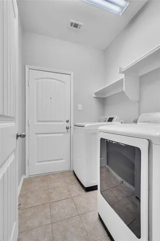 a utility room with washer and dryer