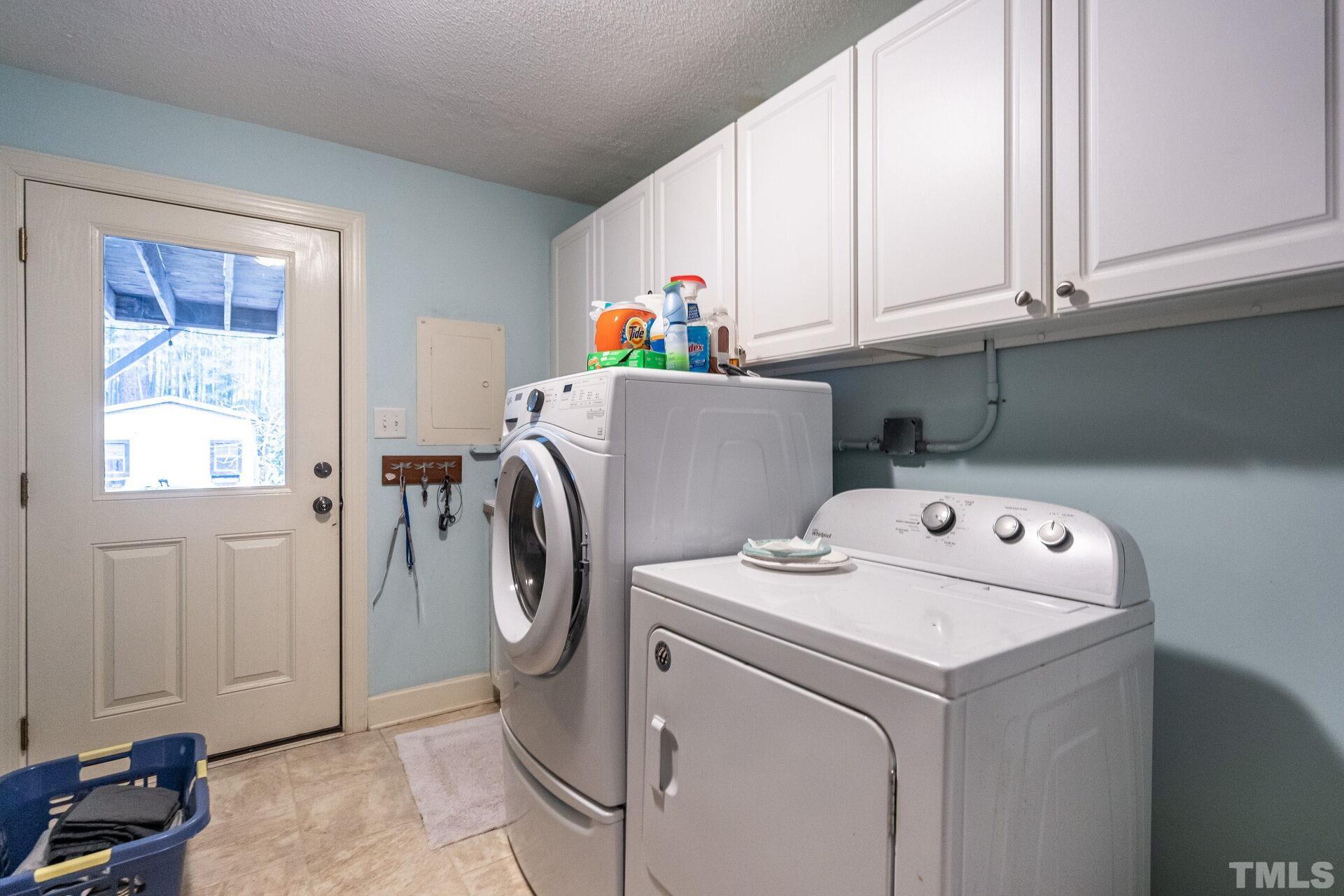 2204 West Charlotte Court Raleigh, NC 27607 - Photo 11 of 31 a utility room with dryer and washer