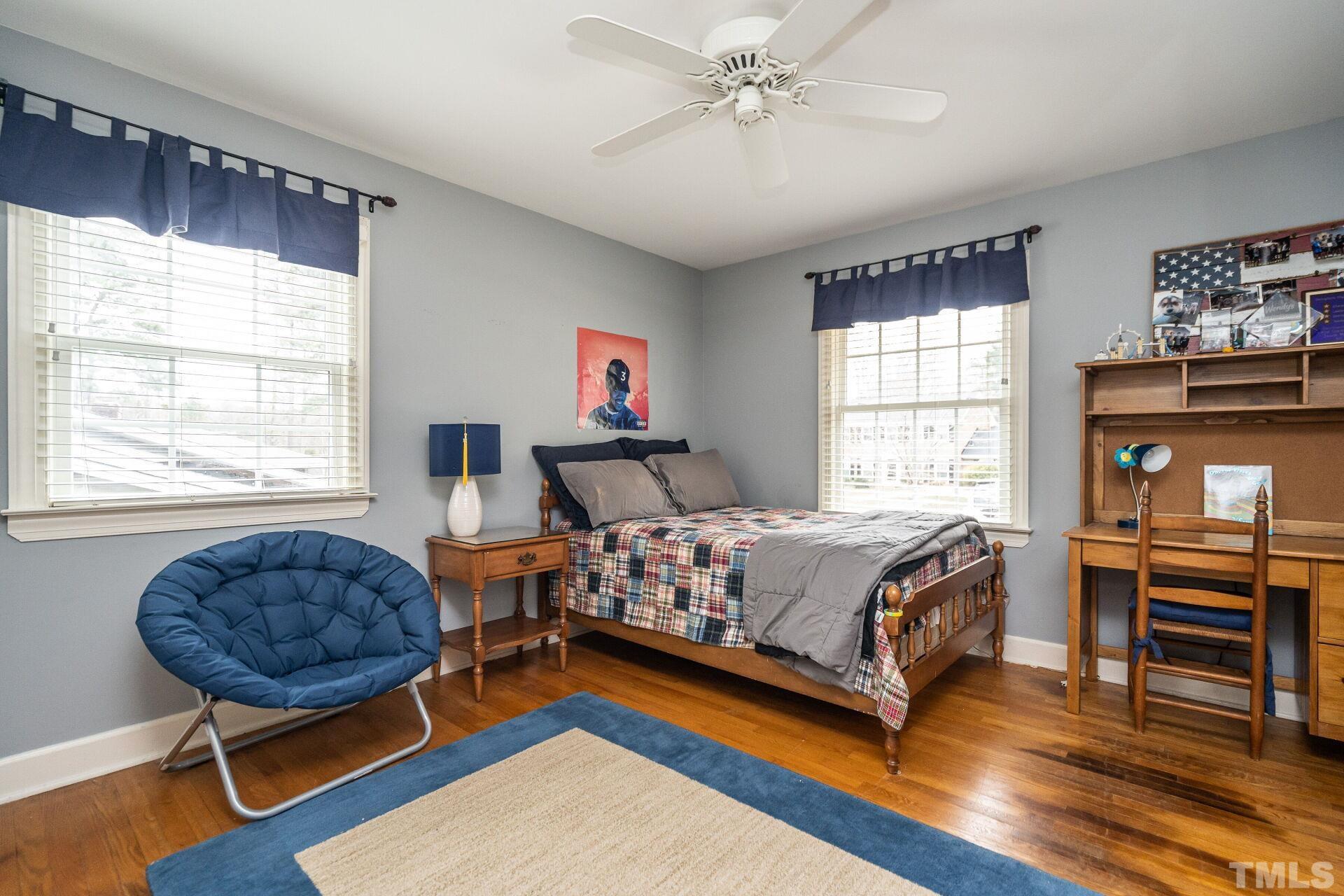 2204 West Charlotte Court Raleigh, NC 27607 - Photo 15 of 31 a bedroom with a bed and a window
