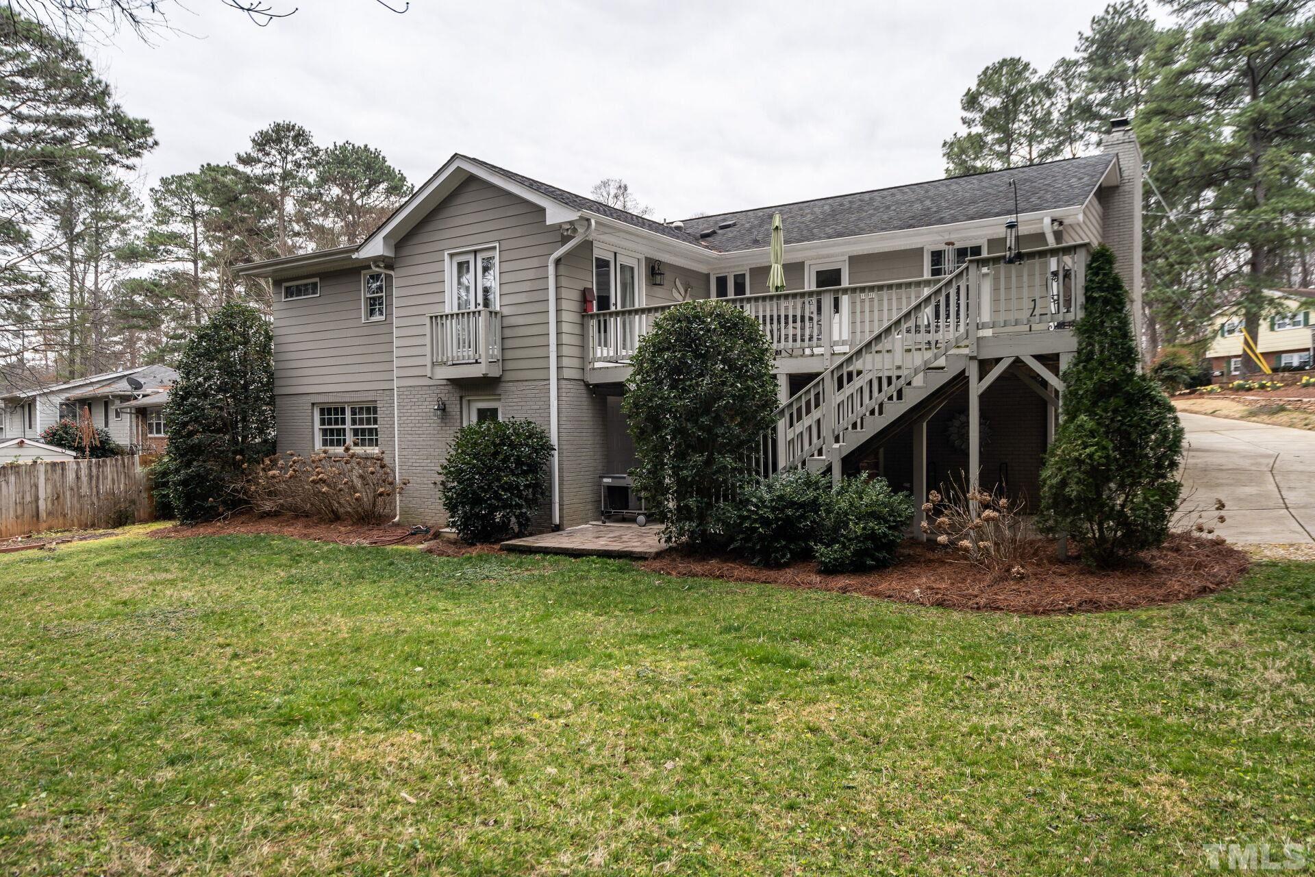 2204 West Charlotte Court Raleigh, NC 27607 - Photo 28 of 31 a front view of a house with a yard and garage