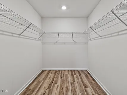 a view of a room with racks on the wall