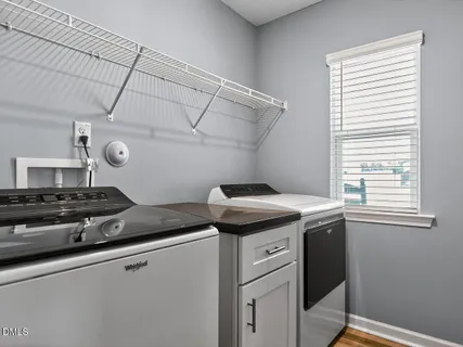 a kitchen with a stove and a window