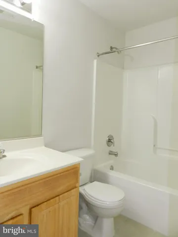 a bathroom with a sink a toilet and a bathtub