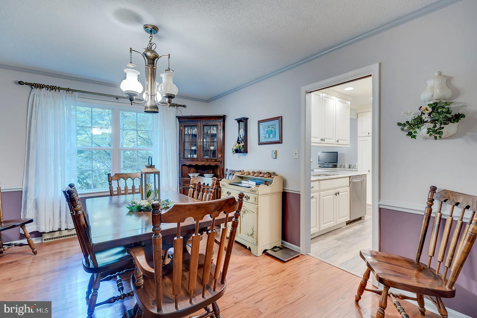 3910 5 Friars Road Salisbury, MD 21804 - Photo 13 of 45 a view of a dining room with furniture window and wooden floor