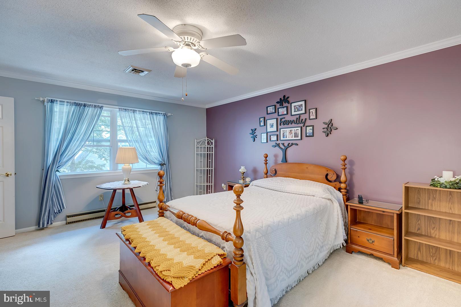 3910 5 Friars Road Salisbury, MD 21804 - Photo 24 of 45 a bed room with a bed and a chandelier