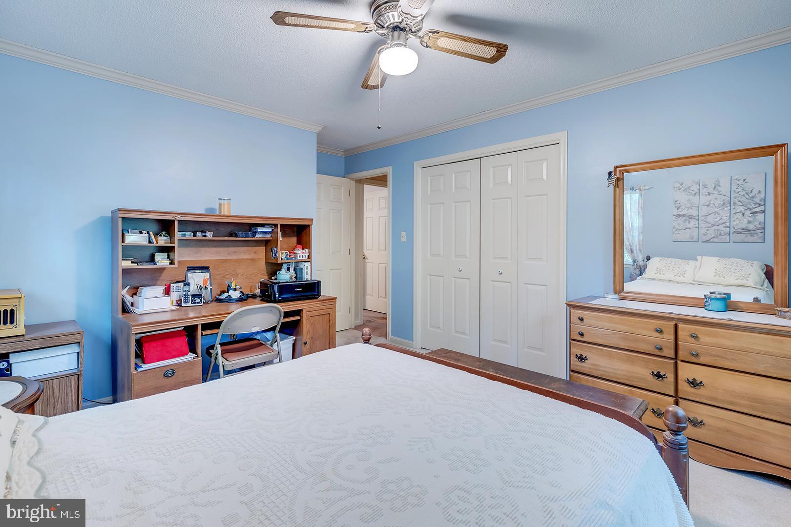 3910 5 Friars Road Salisbury, MD 21804 - Photo 34 of 45 a bedroom with a bed and a chandelier