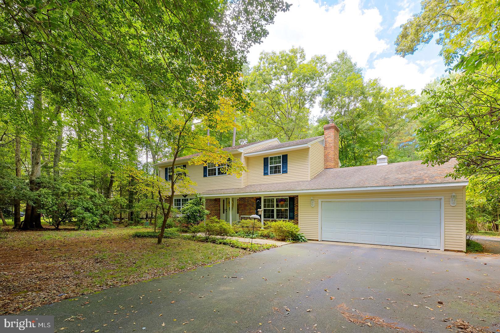 3910 5 Friars Road Salisbury, MD 21804 - Photo 43 of 45 a front view of a house with a yard and garage