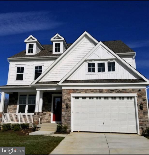 2602 Wing Stem Circle Odenton, MD 21113 - Photo 2 of 3 a front view of a house with a yard