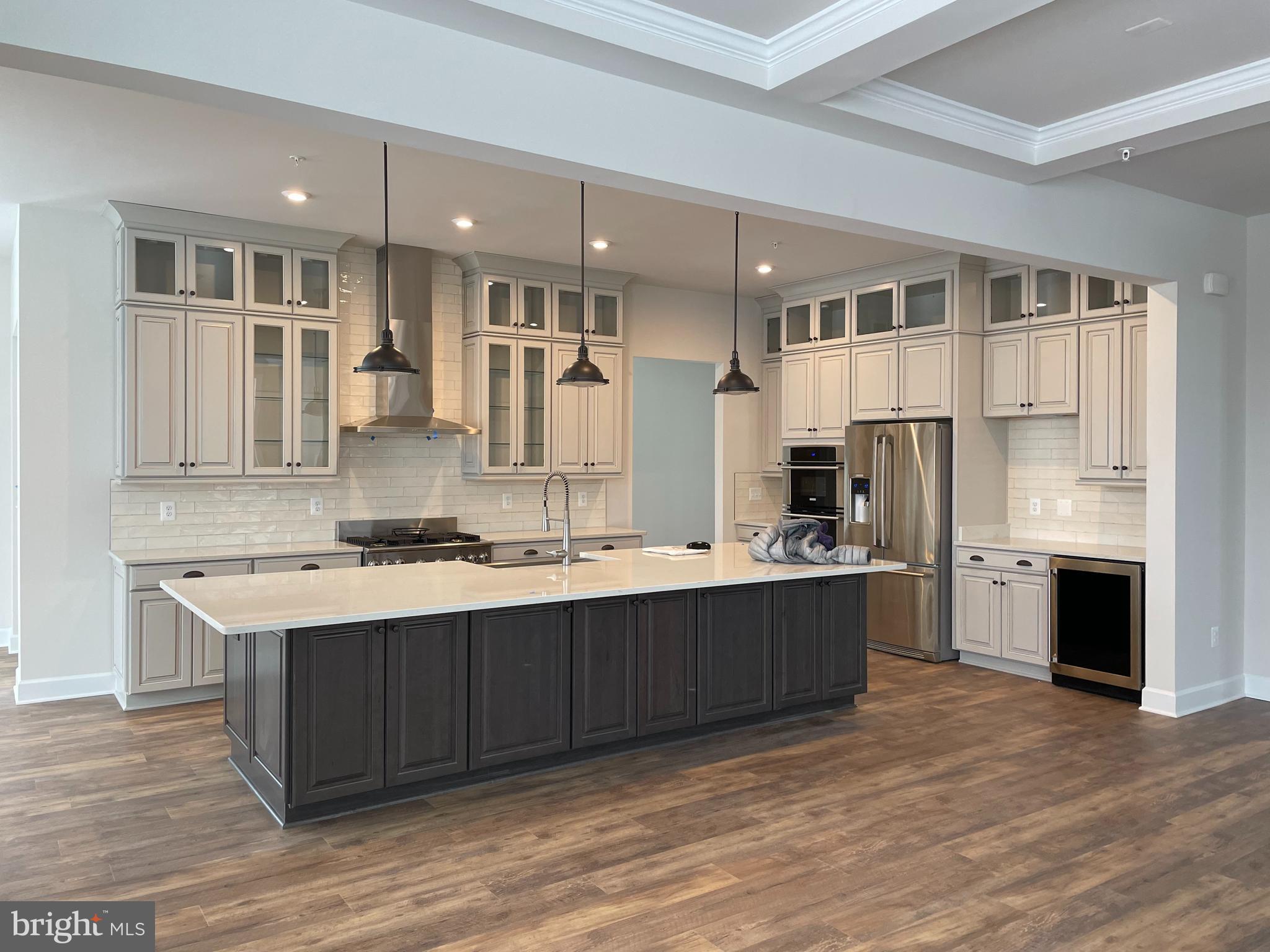 2602 Wing Stem Circle Odenton, MD 21113 - Photo 3 of 3 a large kitchen with stainless steel appliances kitchen island granite countertop a sink and cabinets