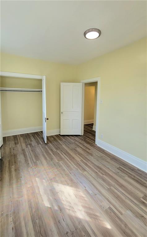 1003 Middle Glenshaw, PA 15116 - Photo 15 of 15 an empty room with wooden floor and a window