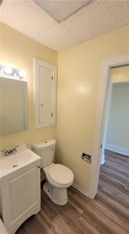 a bathroom with a toilet and a sink