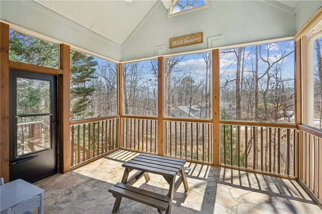 a bedroom with bed and a window
