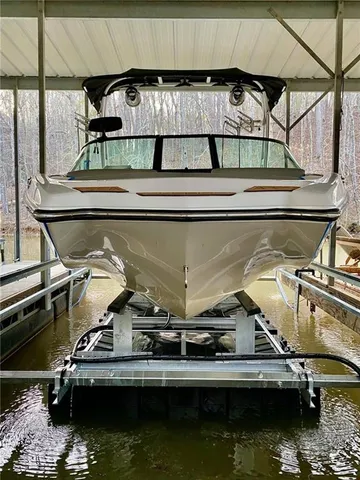 a view of a patio with couches and a table and chairs with garden view
