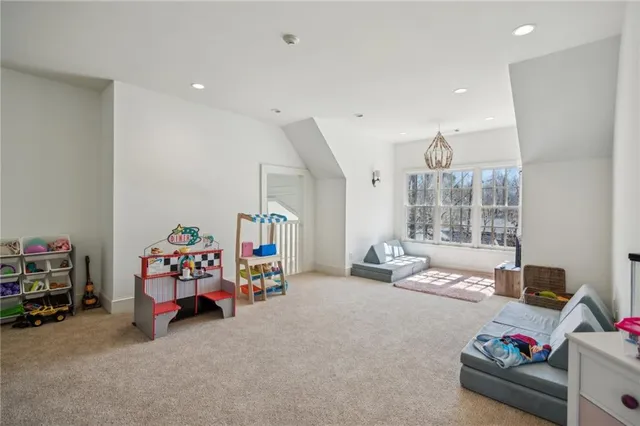 a view of a livingroom with furniture and toys