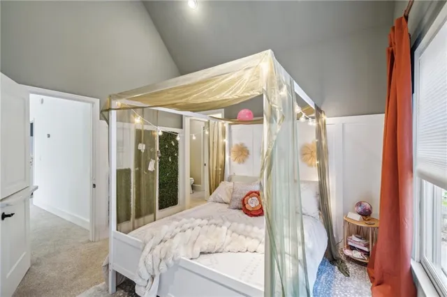a en suite bathroom with a sink double vanity and a mirror